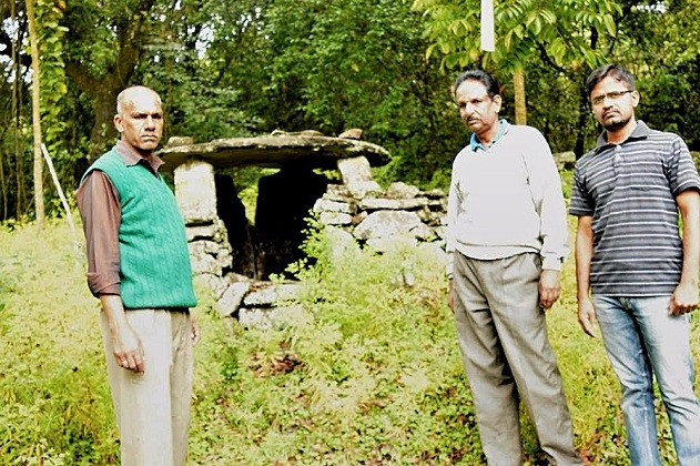 Mani, Ramdas and Prabhu next to a dolmen